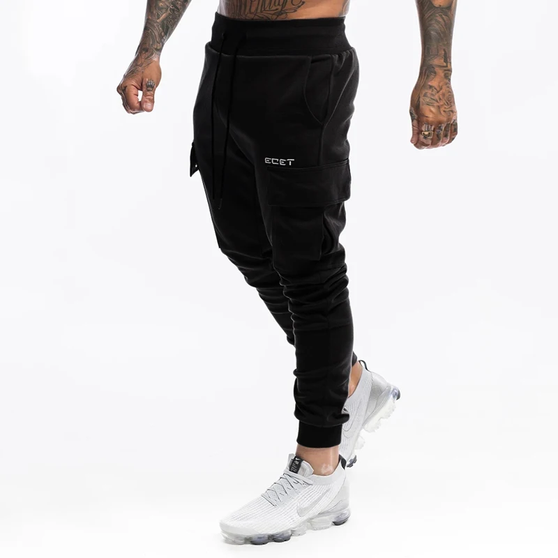 

Muscle fitness new European and American sports men's overalls outdoor fitness trousers running training pants casual pants