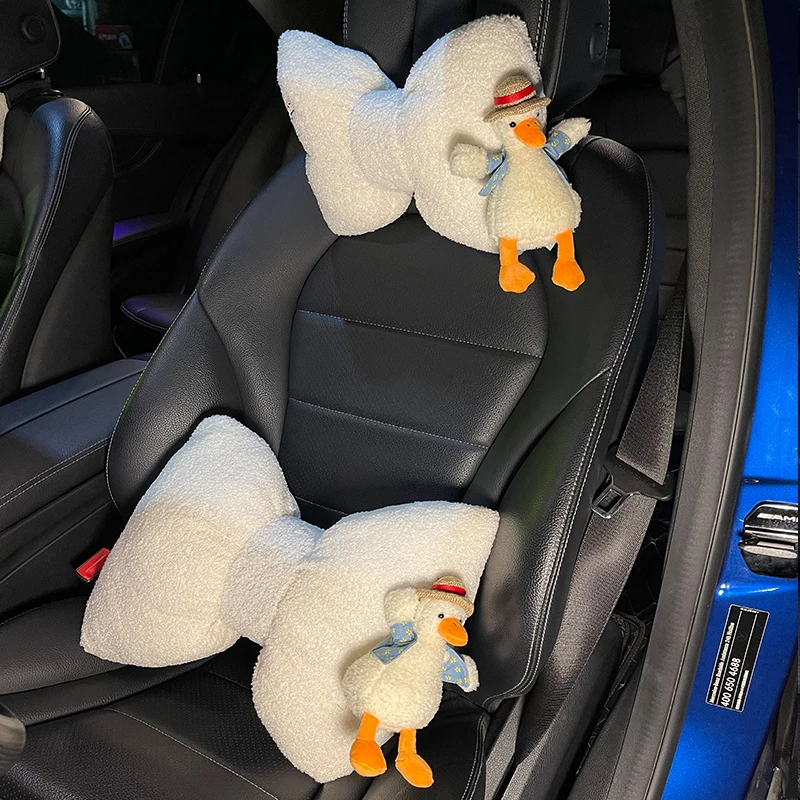 

Net red duck short plush car headrest neck pillow waist by online celebrity cute straw hat duck car seat pillow.