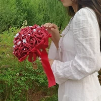 holding flowers artificial flower red rose wedding bouquet with silk satin ribbon bridesmaid bridal party wedding accessories