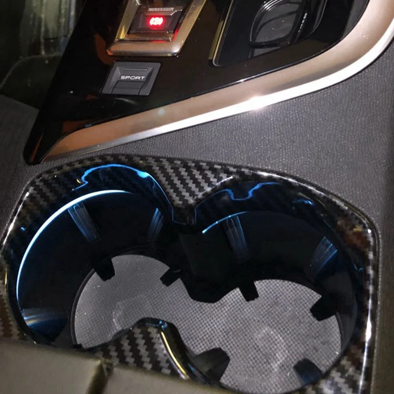 1 шт. наклейки на рамку держателя стакана для автомобиля и 2 шт. контейнера для хранения телефона на передних дверях автомобиля.