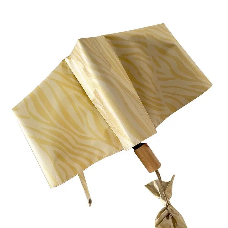 Warm yellow zebra umbrella female ins sunshade three-fold dual-use sunscreen black glue manual sun umbrella