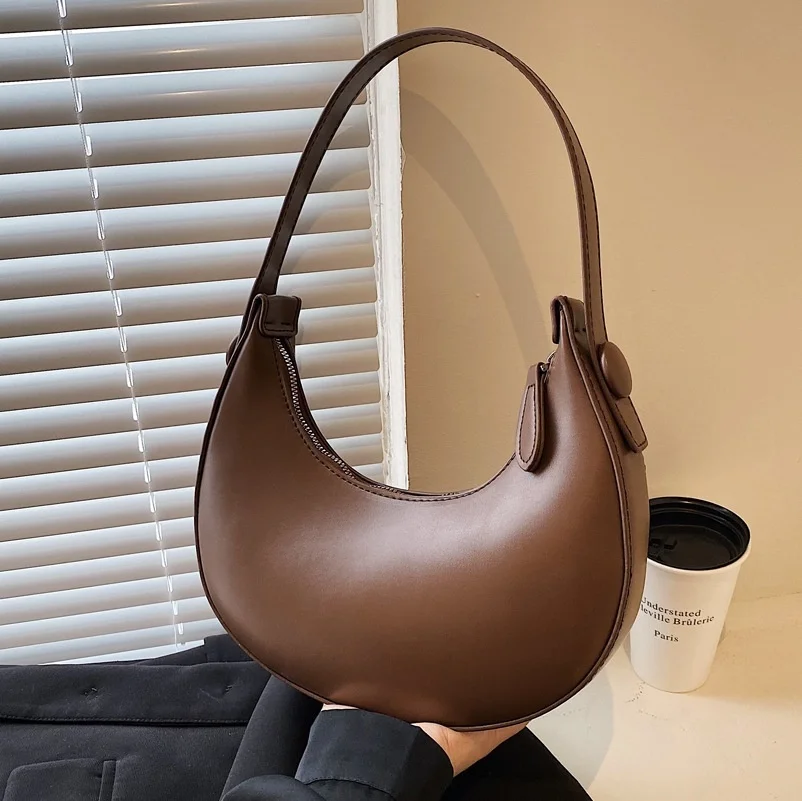 

Women's handbag with minority design in hand new dumpling bag in early autumn 2022 simple pure color single shoulder designer