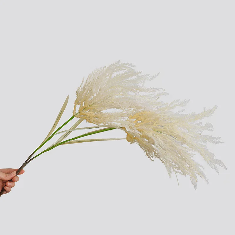 

Nordic soft home furnishings with ornaments and flower arrangement accessories the bride holds a simulated fake flower reed