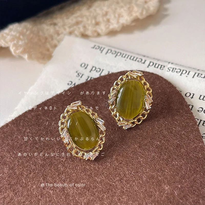 

Retro 925 Silver Needle Plated 14K Micro Zircon Olive Green Glass Cat Eye Stone Oval Earrings Fashion Luxury Earrings Wholesale