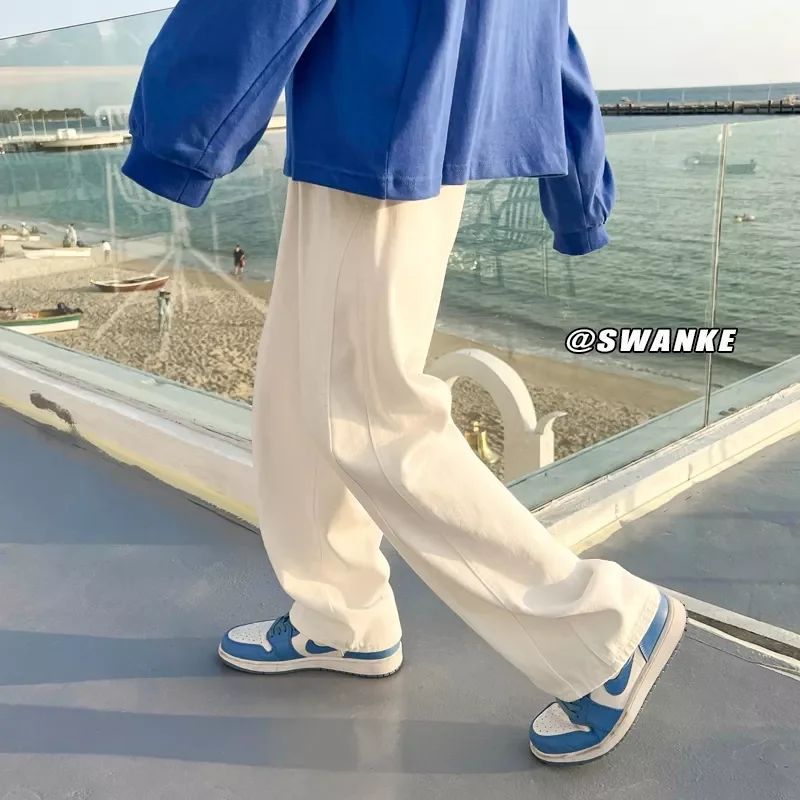 

Новинка лета 2022, новые повседневные джинсы, мужские Модные прямые свободные джинсовые брюки, нейтральная уличная одежда, однотонные универ...