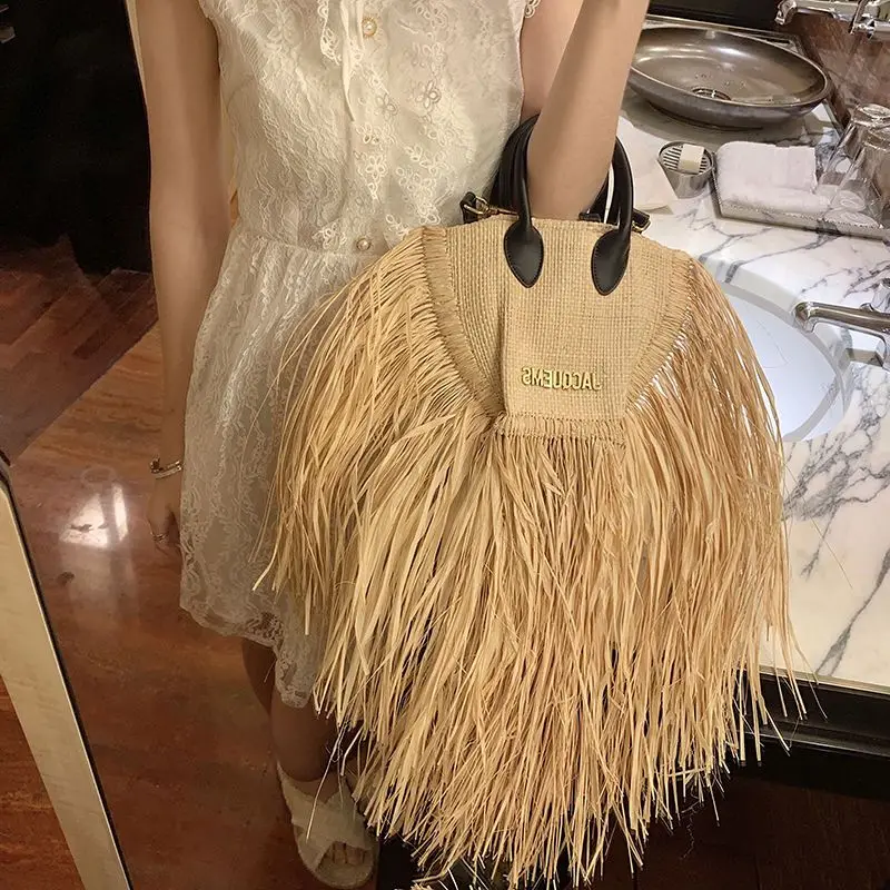 European And American Fashion Tassel Straw Bag 2023 New Summer Vacation Beach Bag With Raw Edge Lafite Handheld Woven Womens Bag