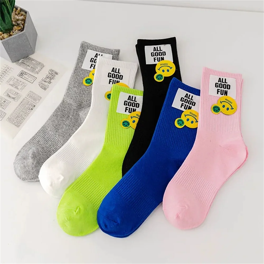 

Korean fluorescent green socks children's medium tube socks smiling face cloth label pink long tube spring and summer color sock