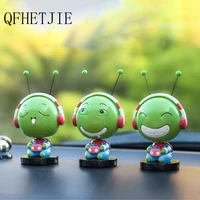 qfhetjie car ornaments cute green hi song bug worm shaking his head doll resin creative cartoon car interior decoration for sale