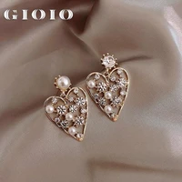new hollow heart earrings popular asymmetric pearl rhinestones japanese and korean girl temperament heart shaped earrings