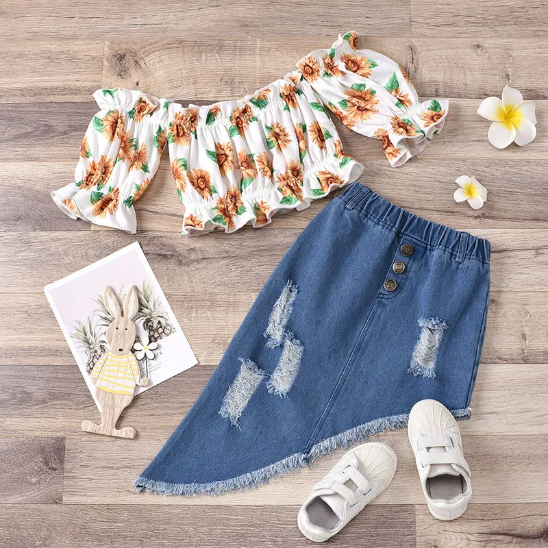 

Girls One-Shoulder Sunflower Print Shrink Sweater + Irregular Beveled Ripped Denim Skirt Two-piece Set girls outfits