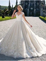 ball gown wedding dresses jewel neck chapel train lace tulle over satin cap sleeve glamorous illusion detail with appliques