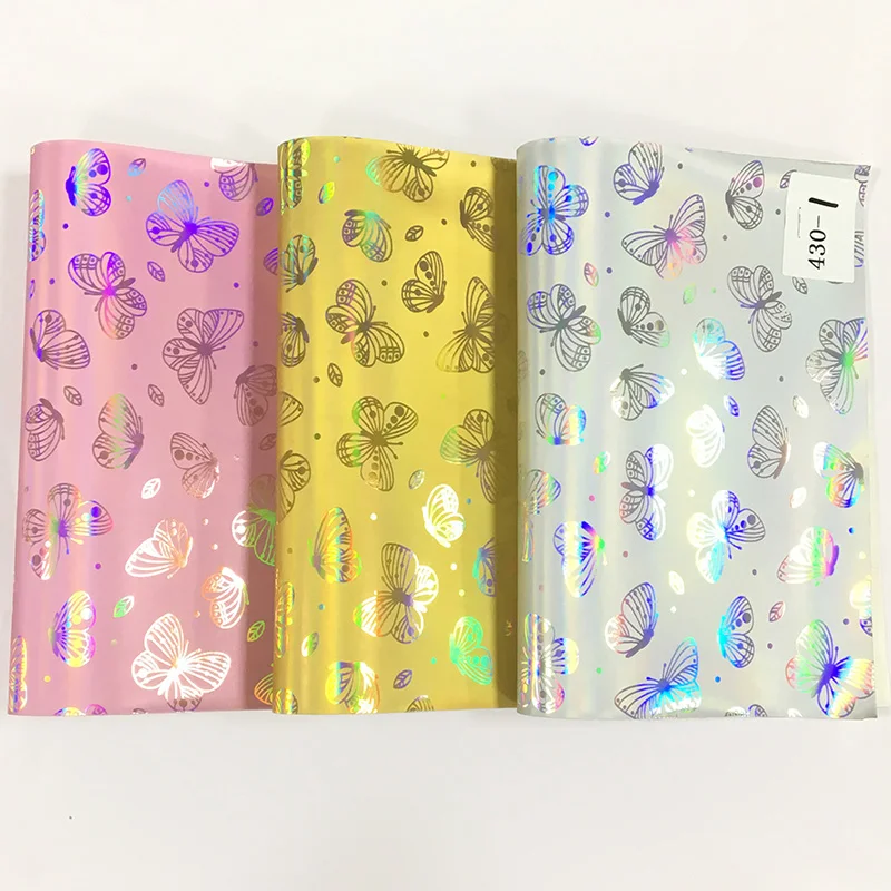 

Butterfly Pattern Embossed Mirror Metallic Laser Effect PU Holographic Faux Leather Fabric for Shoe/Bag/Handbag/Craft