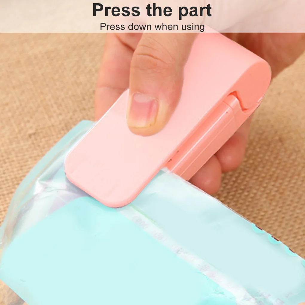 

Mini Sealer Household Sealing Machine Handheld Portable Plastic Mini Packaging Kitchen Sealer pink mini sealer