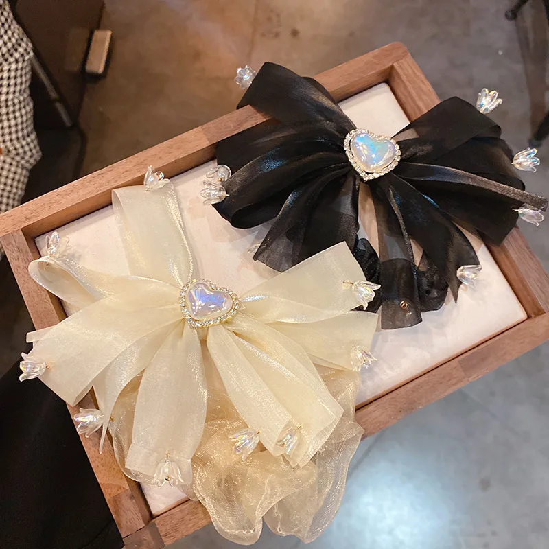

Diamond Encrusted Mermaid Ji Pearl Love Lily Of The Valley Bow Hairband Ins Windnet Red Hair Rope Versatile Sweet Accessory