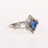 noble and elegant woman with sapphire princess ring