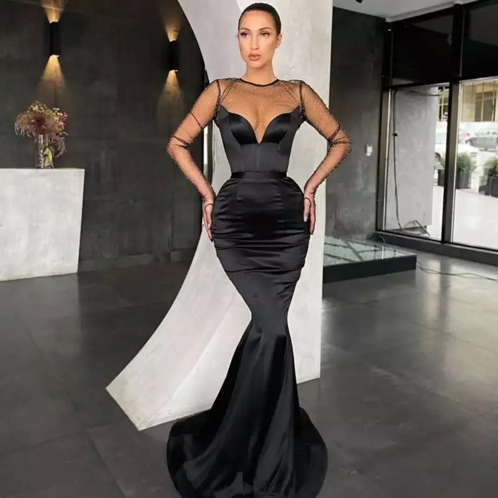

2022 Sexy Sparkly Black Long Sleeve Mermaid Prom Dresses Sheer O-Neck Sequined Floor Length Formal Party Evening Gowns Satin