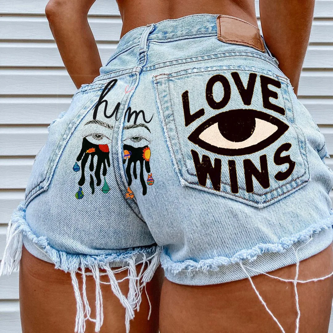 

INS eye graffiti print pocket pattern young girl casual shorts women's summer new ripped tassel denim shorts hot pants