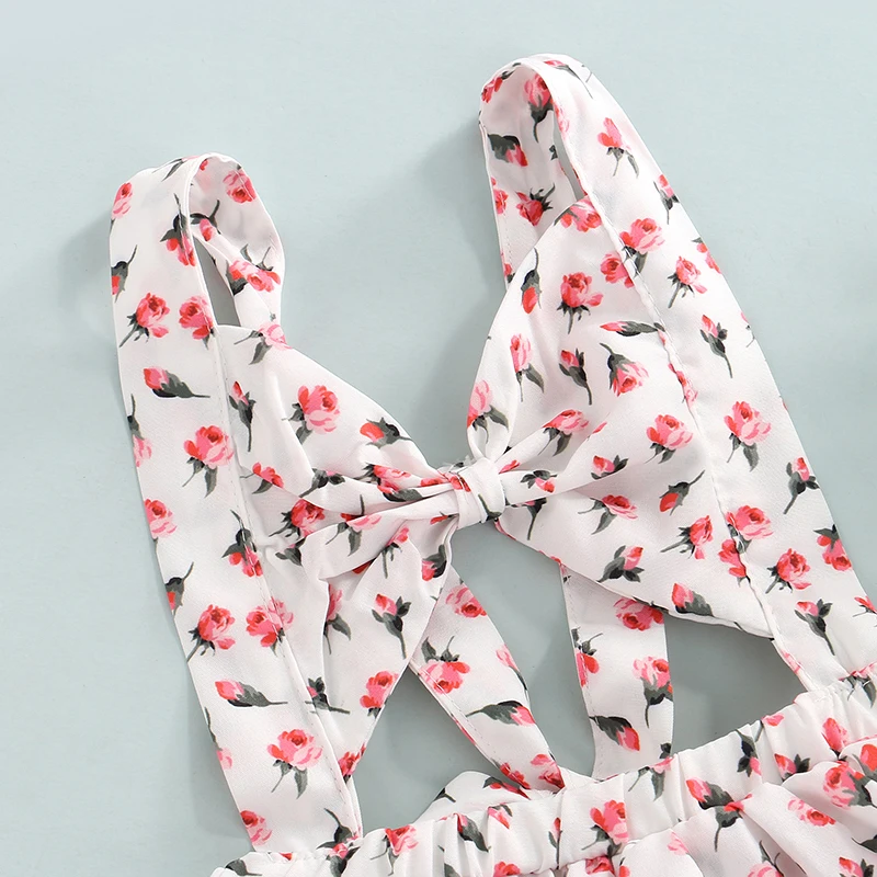 Детское платье-комбинезон с вырезами и бантом спереди |