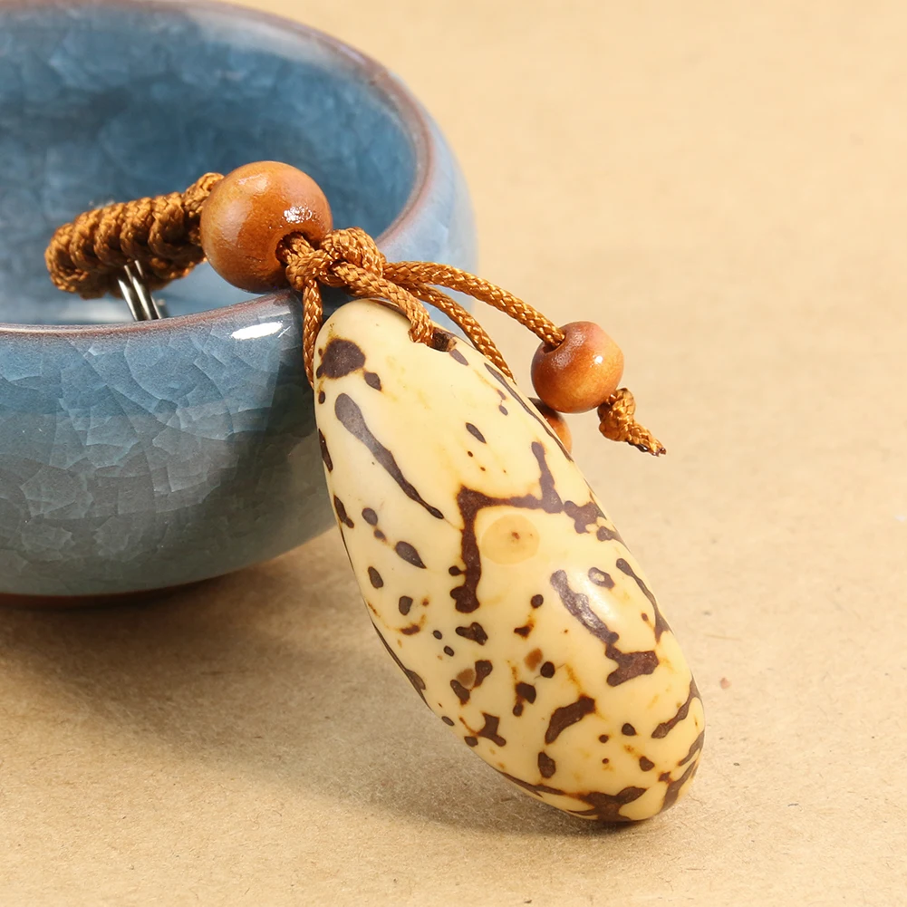 

Personality Creative Natural Material Polished Thousand Eyes Bodhi Handlebar Key Chain Pendant DIY Car Pendant School Bag Buckle