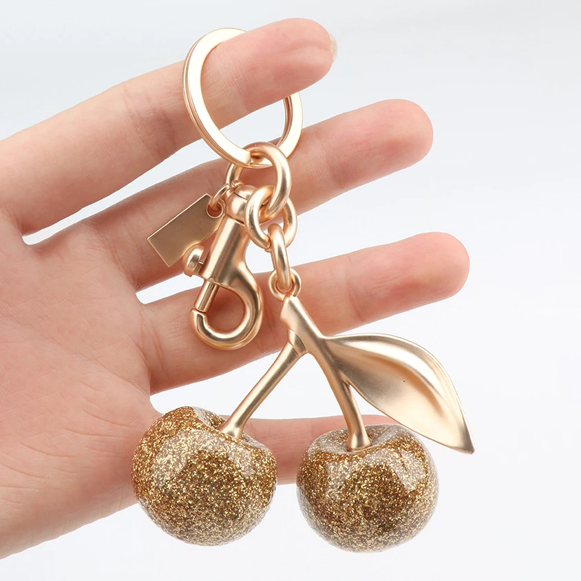 Сверкающий золотой кулон с вишней для сумки