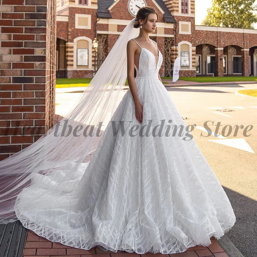 

Awesome Spaghetti Straps Wedding Dress 2023 A-Line for Brides with Backless V-Neck Applique Sequins Beads Pearls and Court Train