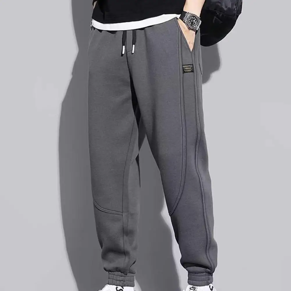 

Mid-rise Elastic Waistband Sport Pants Drawstring Pockets Shrinkable Cuffs Men Solid Color Casual Sweatpants Streetwear Trousers