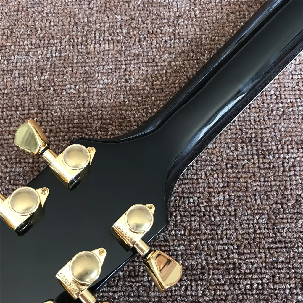 Новое поступление электрическая гитара с черным грифом и золотистым корпусом