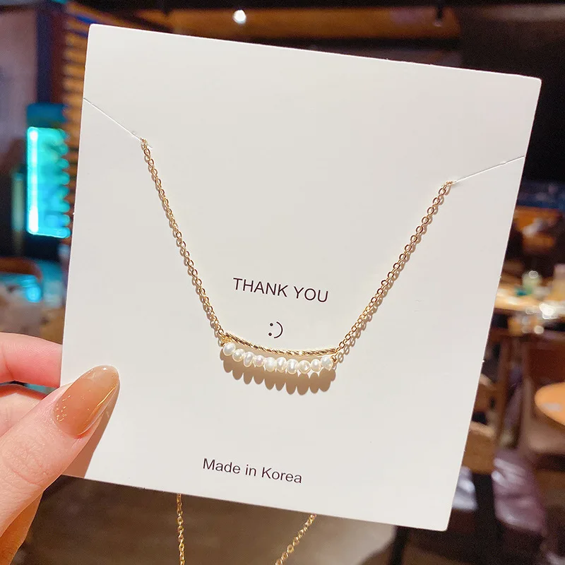 

Оптовая продажа, новое простое ожерелье из титановой стали высокого качества для женщин, модное яркое короткое жемчужное ожерелье в холодн...