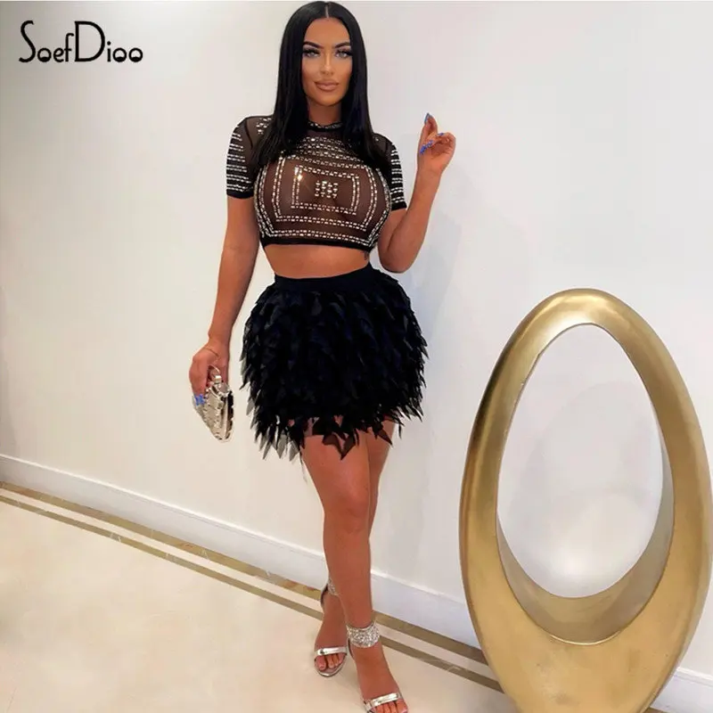 

Женский комплект из двух предметов Soefdioo, черный сетчатый укороченный топ с круглым вырезом и коротким рукавом и мини-юбка с кисточками, комп...