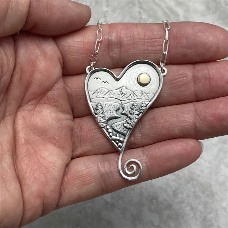

Modern Sense Mountain Forest Flowing Water Bird Sun Love Peach Heart Shape Pendant Necklace Fashion Women Metal Necklace Jewelry