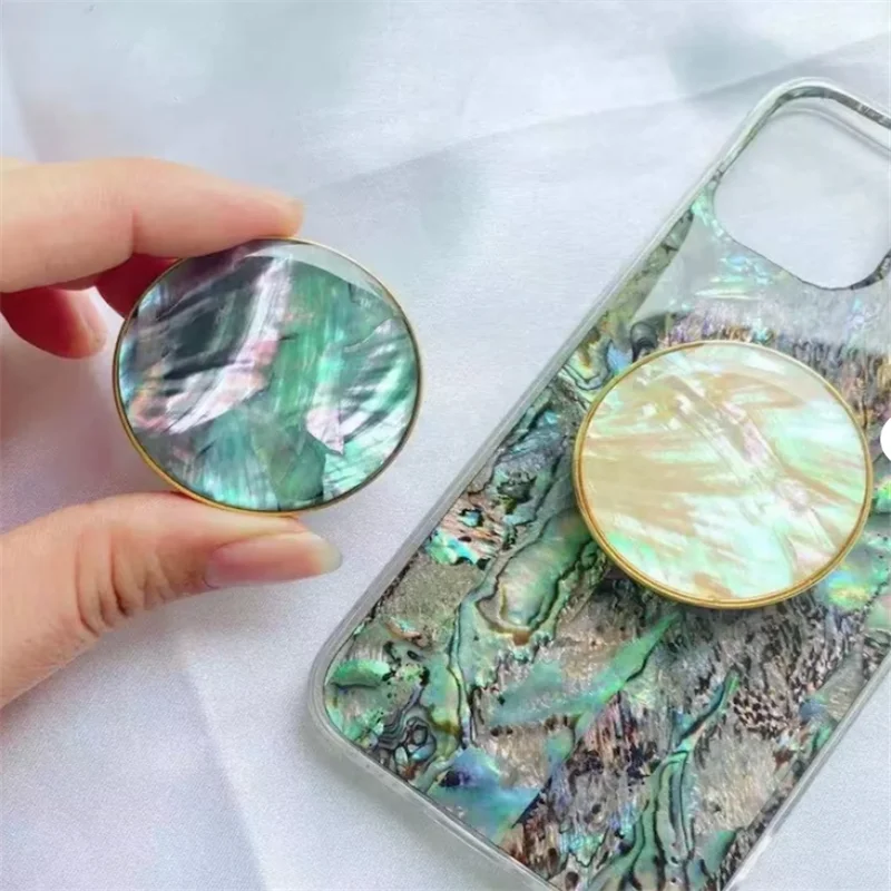 

Natural Mother of Pearl Phone Grip Gold Phone Holder Sea Shell Luxury Collapsible Round Seashell Cell Phone Grip and Stand Top