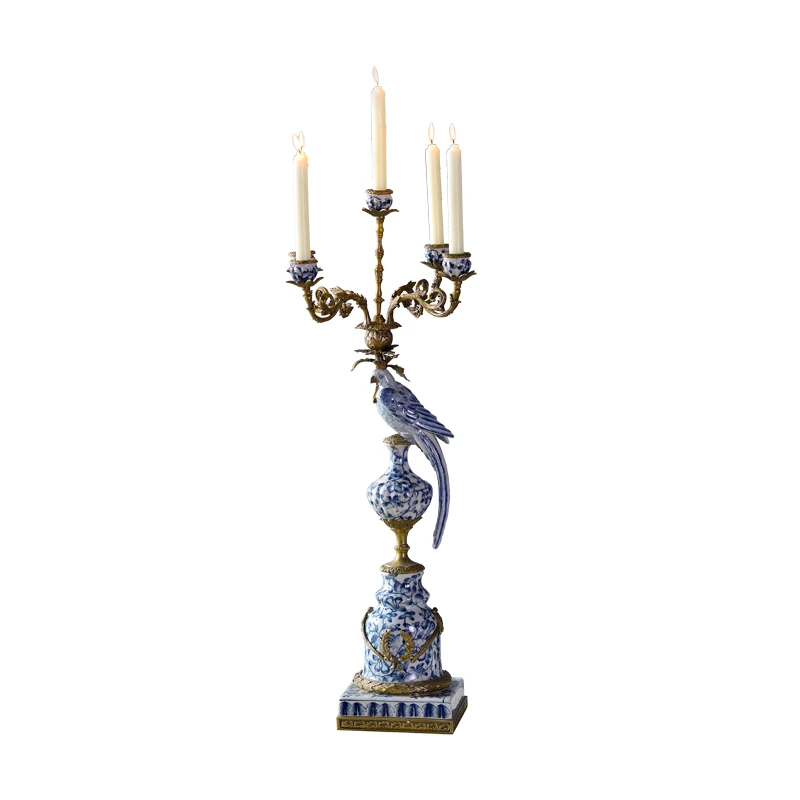 

A beautiful parrot home decor candle holder made of porcelain and bronze and inspired by a vintage design ceramic candlestick