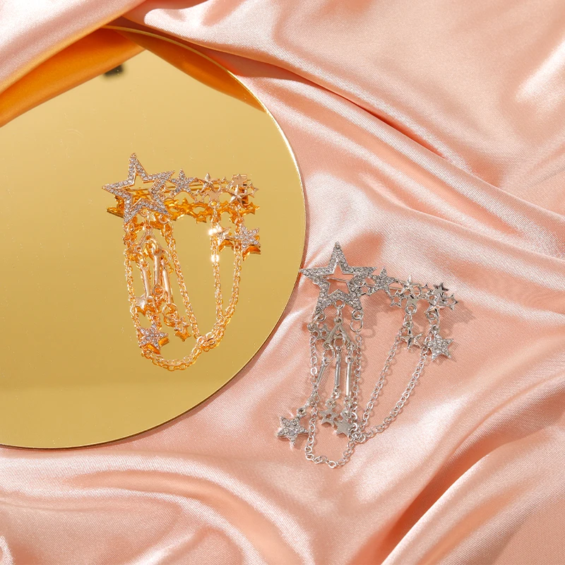 Женская брошь в форме скрипки золотого и серебряного цвета