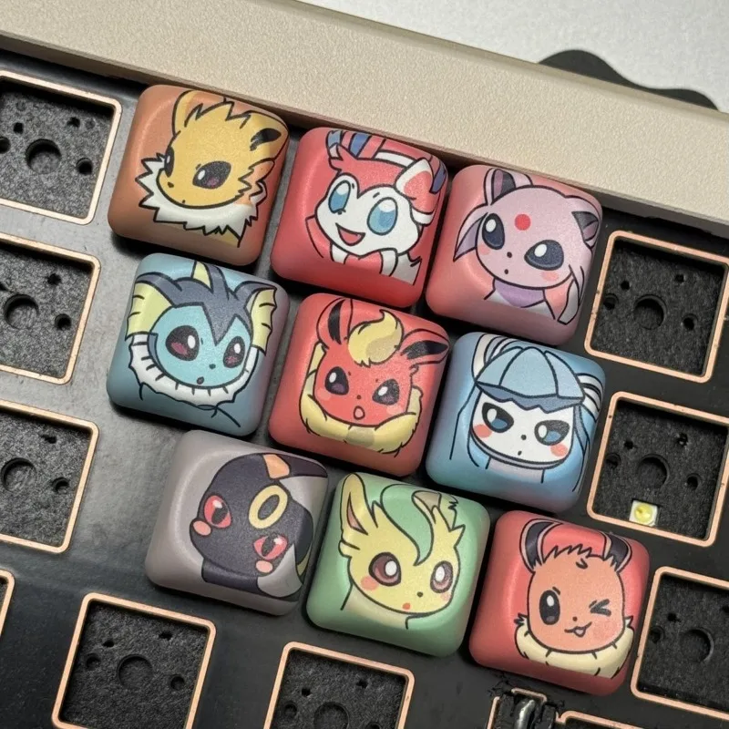Фото Колпачки для клавиш Pokemon Eeveelutions MOA Profile PBT, кастомные колпачки для клавиш Eevee, для механических клавиатур с крестообразным креплением, для ESC, Page Up, Page Down №1