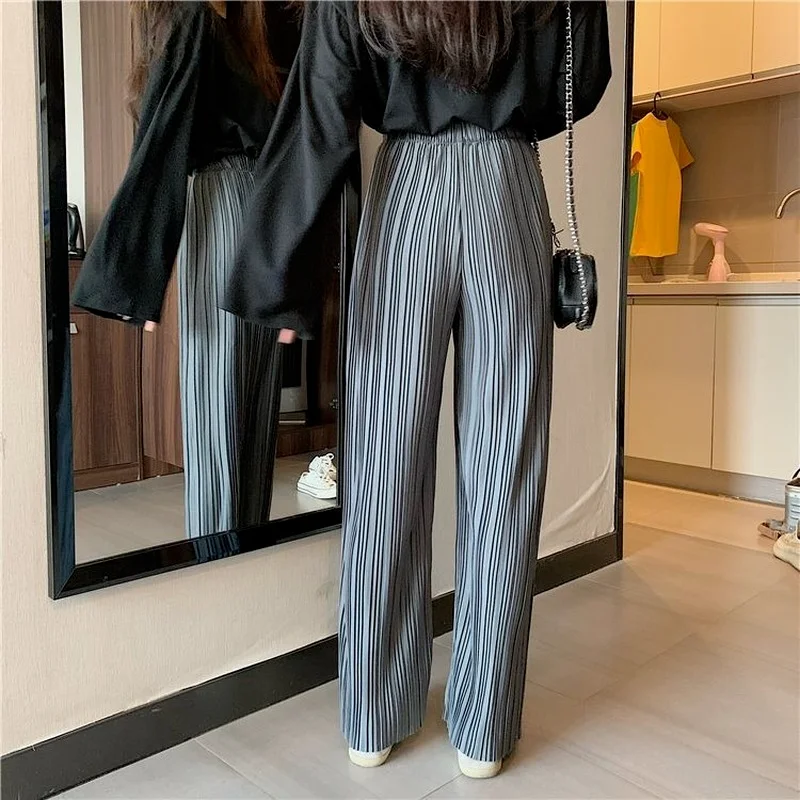 Женские длинные брюки свободные однотонные в складку универсальные