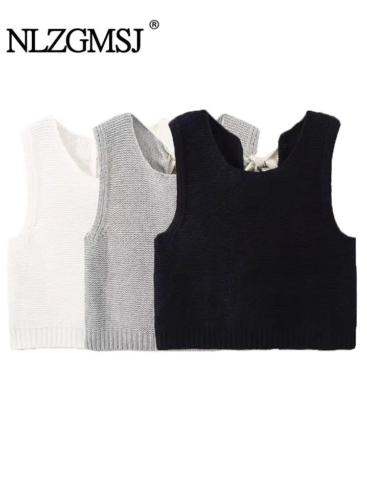 Женский трикотажный кардиган с бантом без рукавов круглым вырезом