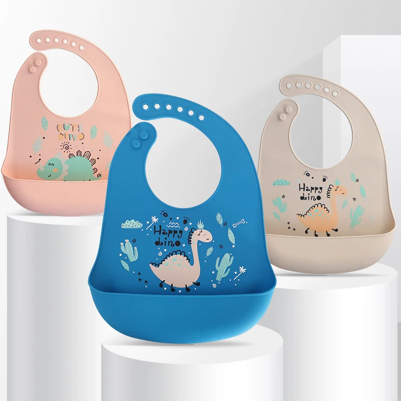 

Cartoon Dinosaur Baby Bibs Waterproof BPA Free Silicone Baby Bib With Buttons Toddler Girl Boy Adjustable Baby Feeding Stuff