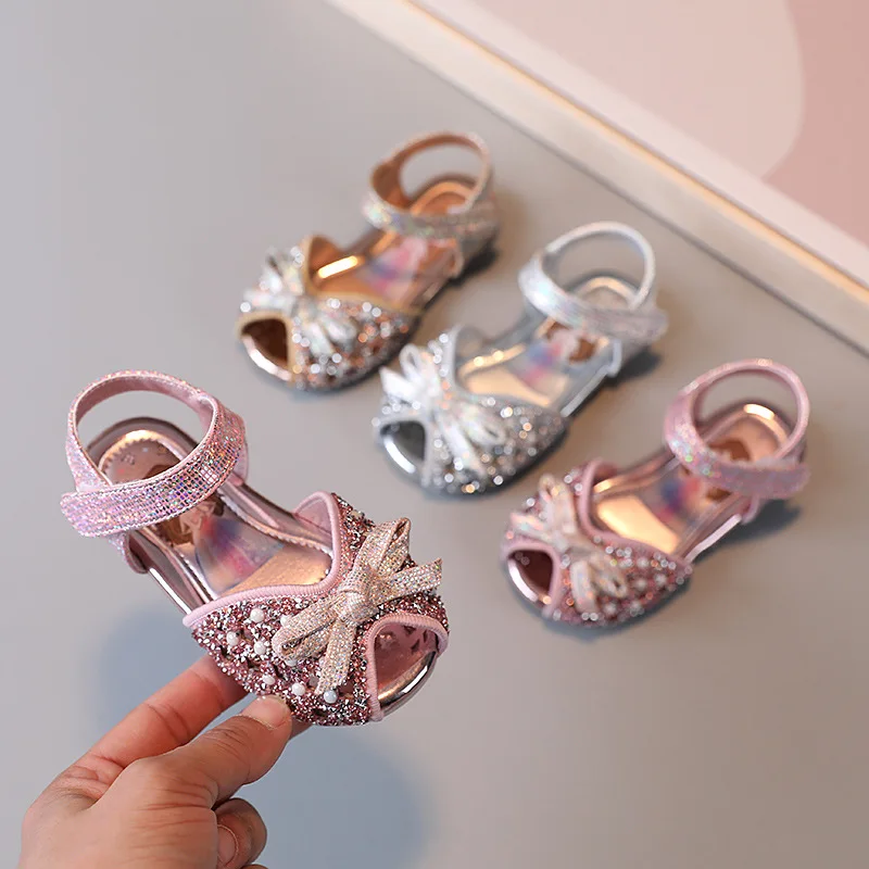 

Baby Girls Sandals 2022 Summer Kids Bowtie Princess Shoes Soft Sole Student Sandals Children Rhinestone Birthday Party Shoes