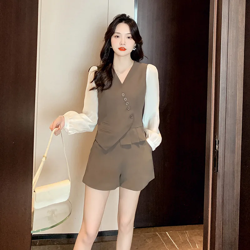 

real photo 2022 autumn new simple temperament irregular oblique button color matching tops fashion wide-leg shorts suit women