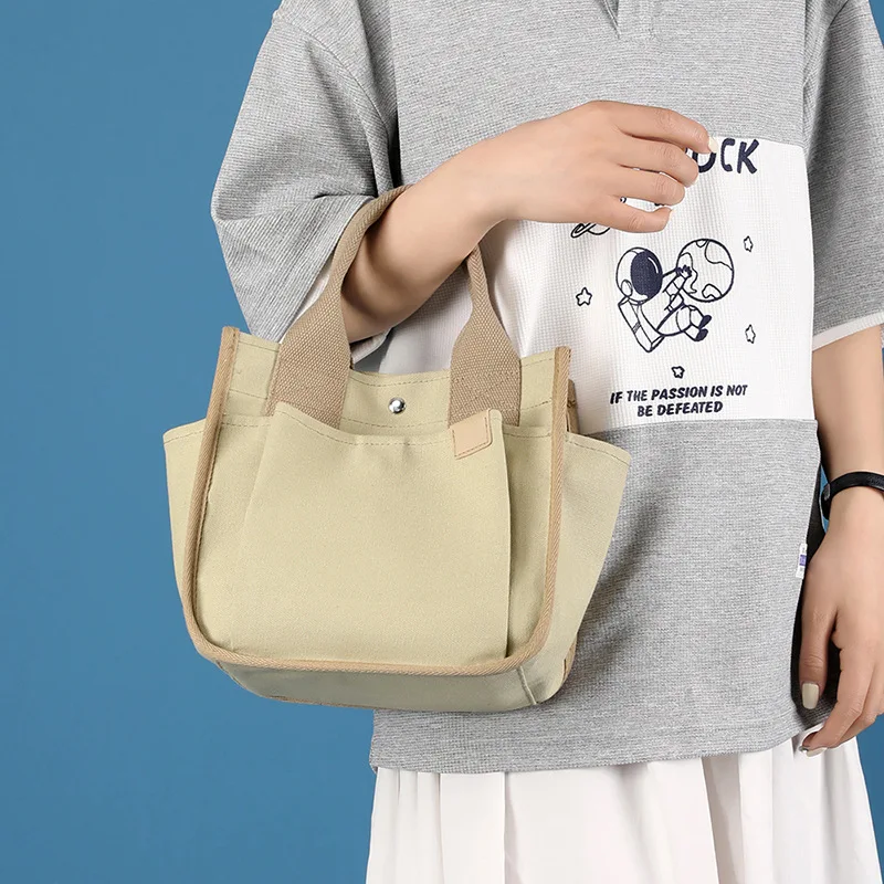 

Fashion Handheld Tote Bag Canvas Bag Women's 2023 New Canvas Multi layered Casual Simple Versatile Casual Large Capacity Bag