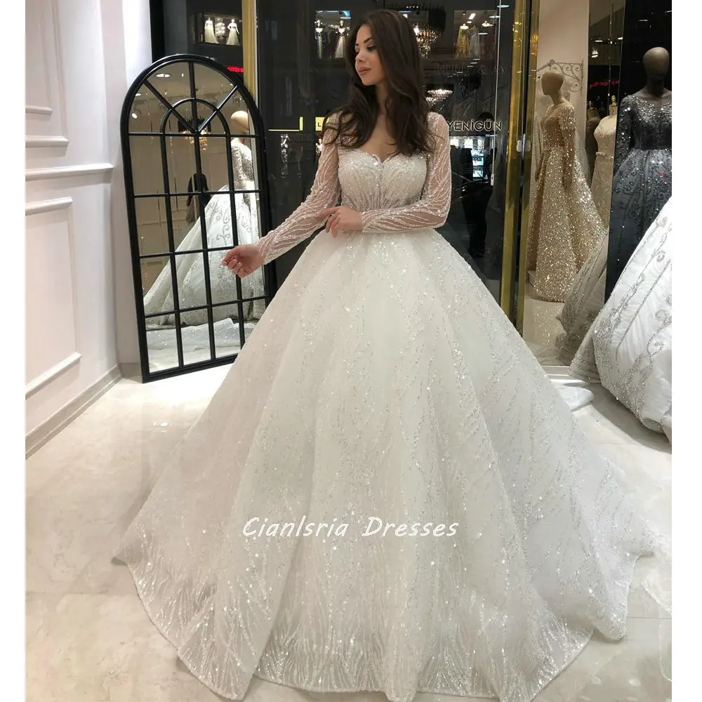 

Shiny Crystal Beading Long Train Dubai Ball Gown Wedding Dress Scoop Illusion Full Sleeve Sequined Saudi Arabic Bridal Gown