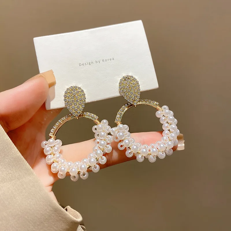 

Женские серьги-гвоздики с цирконом