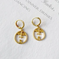 allnewme chic abstract face hanging earring brass gold hollow out round coin statement drop earrings for women fashion jewelry