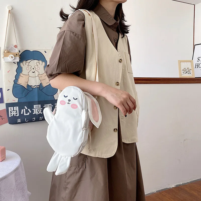 

Women Cartoon small shoulder bag 2022 ins funny personality Girl cute messenger mobile phone bag