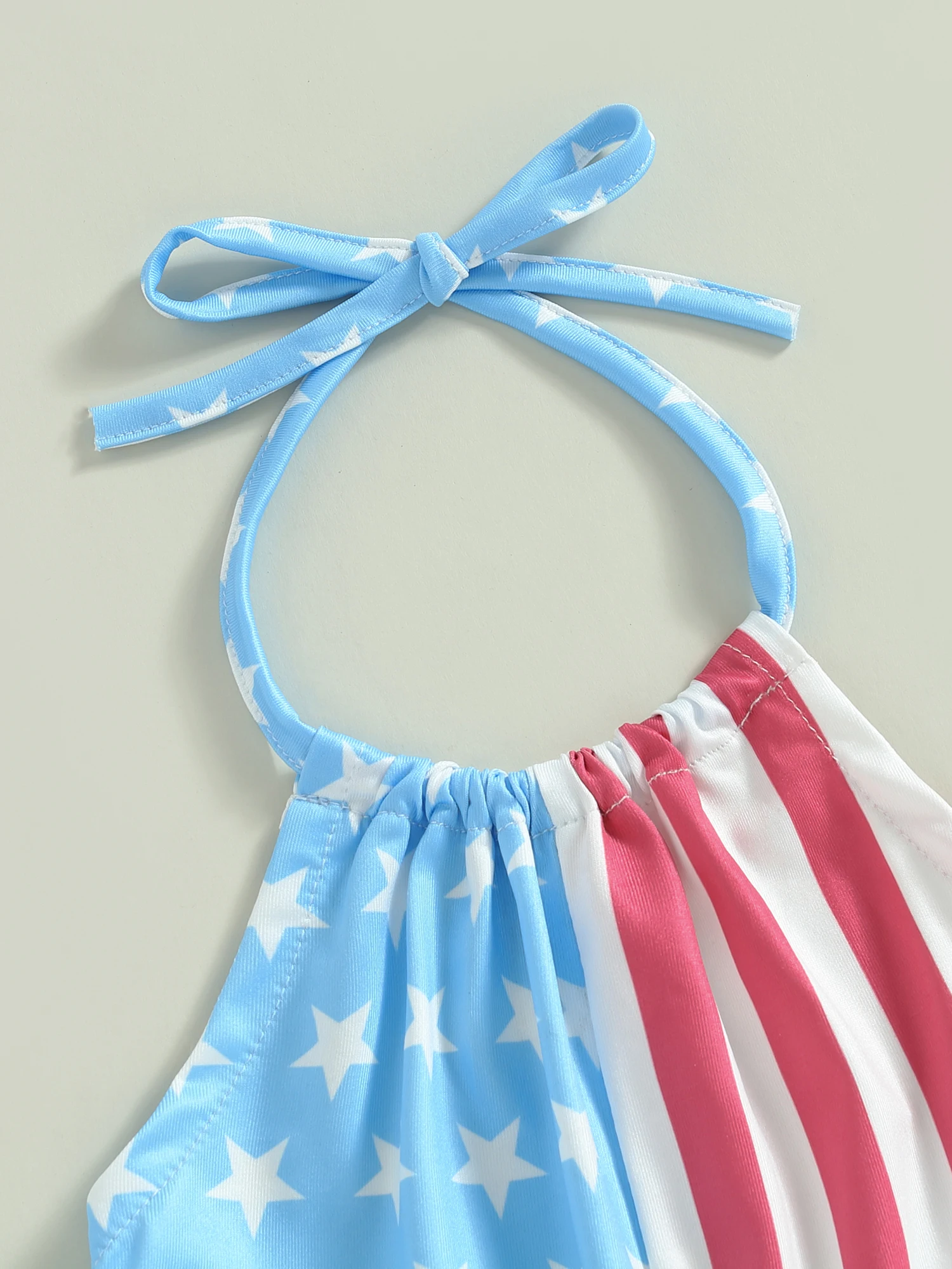 

Adorable 2-Piece Baby Girl 4th of July Set with Halter Crop Top and Floral Bell Bottoms - Perfect for Your Little Patriot