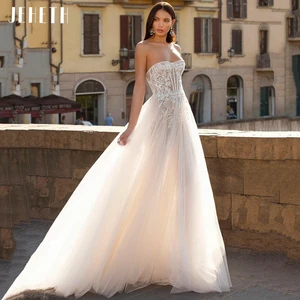 JEHETH Elegant Srapless A-Line Tulle Wedding Dress Simple Illusion Backless Lace Applique Bridal Gow in Pakistan