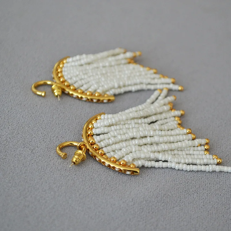 

New Fashion Trend White Rice Beads Irregular Tassel Earrings