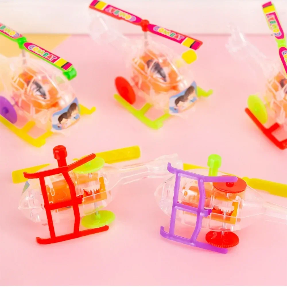 

1Pc Cartoon Cute Transparent Helicopter Toys Favorite Birthday Party Favors Airplane Wind Up Aircraft for Kids Toddler Gift
