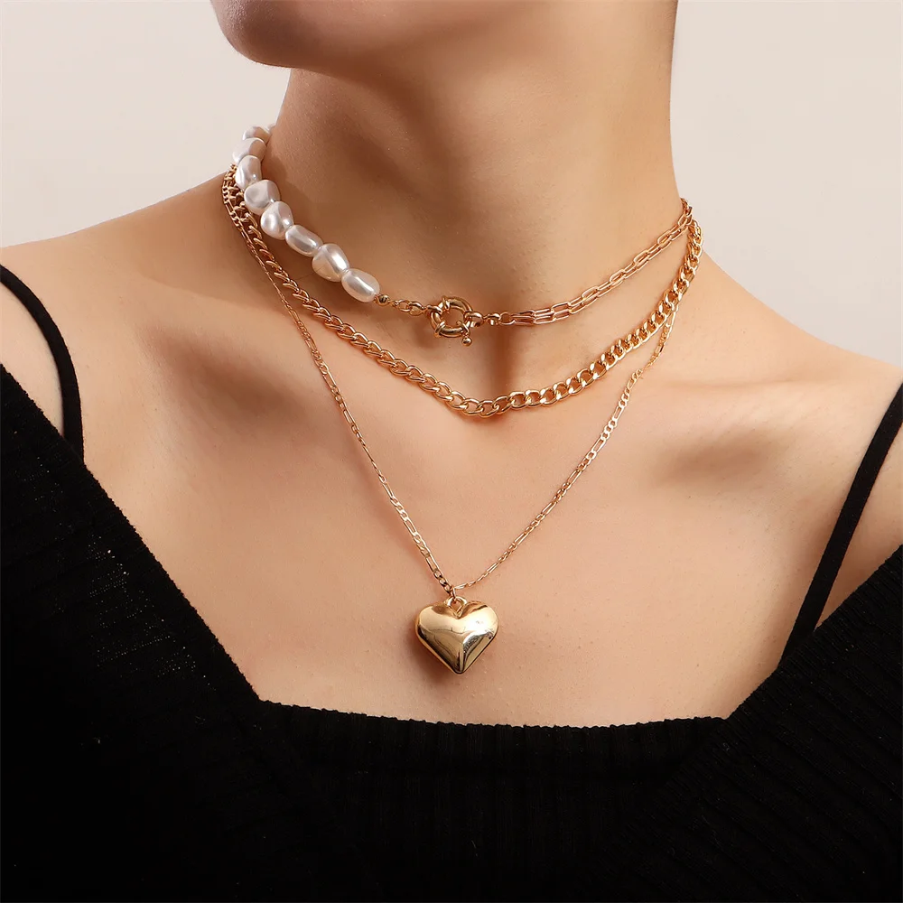 

Metal wind shaped pearl exaggerated big peach heart necklace Valentine's Day multi-layer love necklace sweater chain