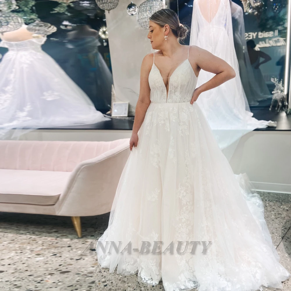 

Anna V Neck Tulle Fancy Wedding Dresses For Women 2023 Bride Charming Appliques Backless Spaghetti Strap Sweep Train Sleeveless